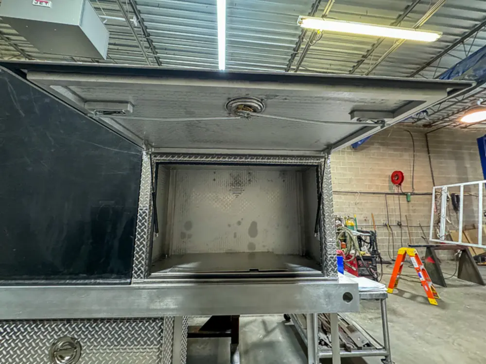 Open compartment interior during fabrication, photo 134 of 303.